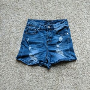 Ripped blue jean shorts